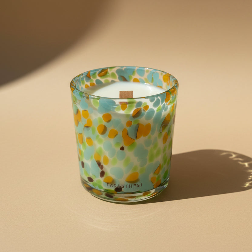 Colorful patterned candle holder on a light background