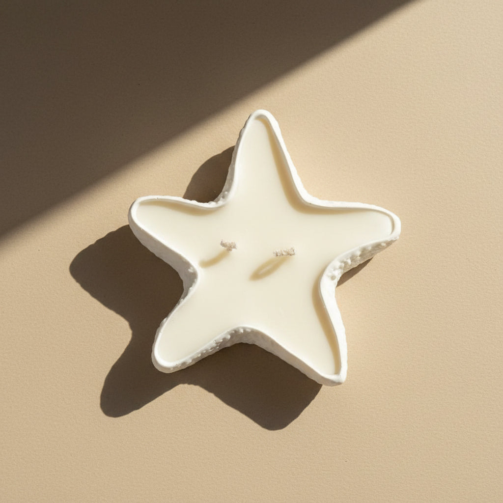 Star-shaped porcelain tray filled with a candle on a beige background