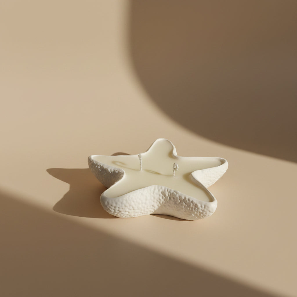 Star-shaped porcelain tray filled with a candle on a beige background