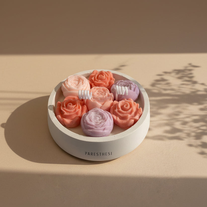 Bloom Harmony Candle 200ml. Flower in a white porcelain vessel in a beige background