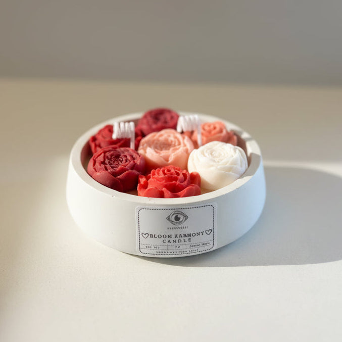 Bloom Harmony Candle 200ml. Flower in a white porcelain vessel in a light background