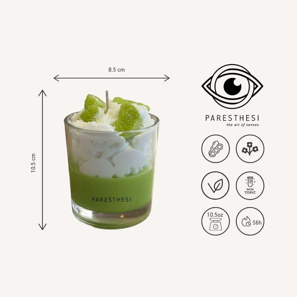 Green candle in a glass container with dimensions and Paresthesi branding on a white background