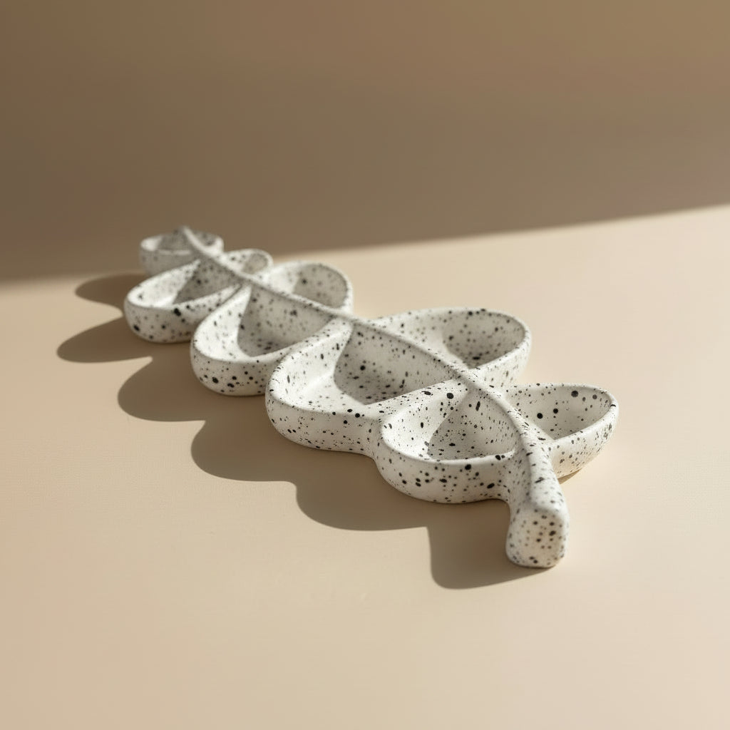 White porcelain tray with a textured, organic design on a white background