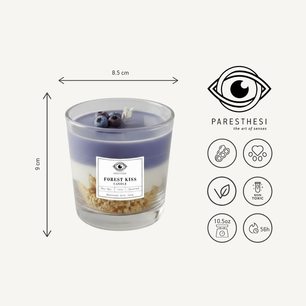 Candle labeled 'Forest Kiss' with dimensions and Paresthesi branding on a white background